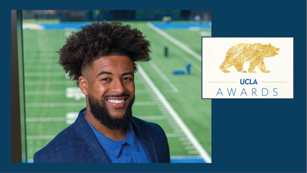 young man next to logo showing bear