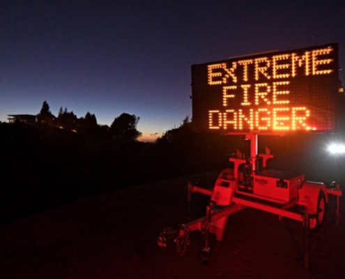 Sign reading 'Extreme Fire Danger' at night