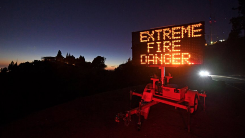 Sign reading 'Extreme Fire Danger' at night