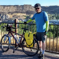 Man with bike outdoors