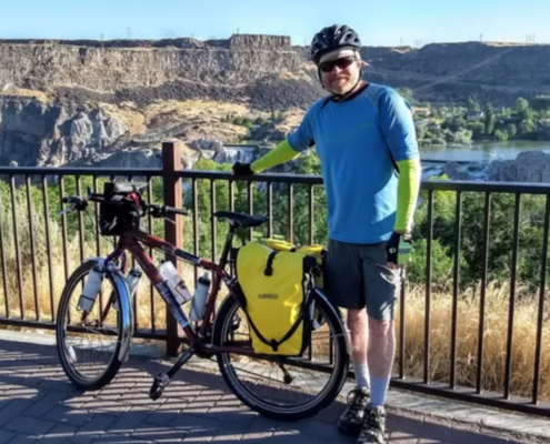 Man with bike outdoors
