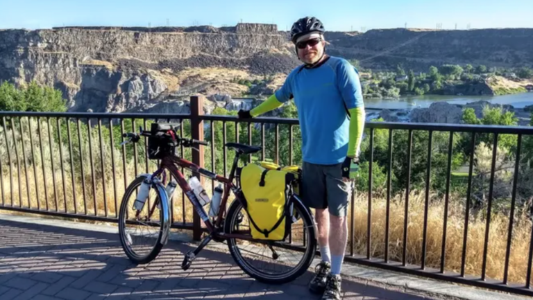 Man with bike outdoors