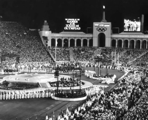 historic black and white picture of L.A. Coliseum during Olympic ceremony