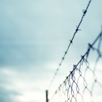 barbed wire above chainlink fence