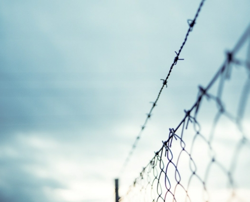 barbed wire above chainlink fence