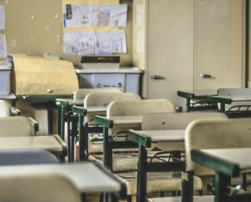 desks and chairs in empty classroom