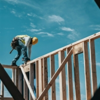 Construction worker on wood frame