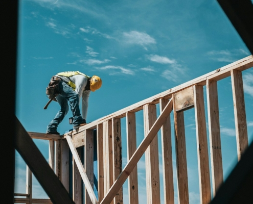 Construction worker on wood frame