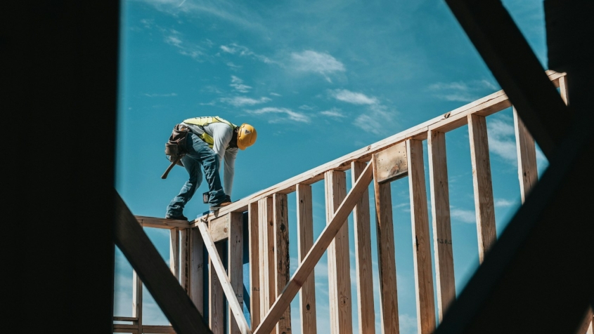 Construction worker on wood frame