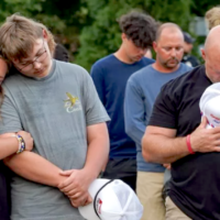 adults and students at vigil