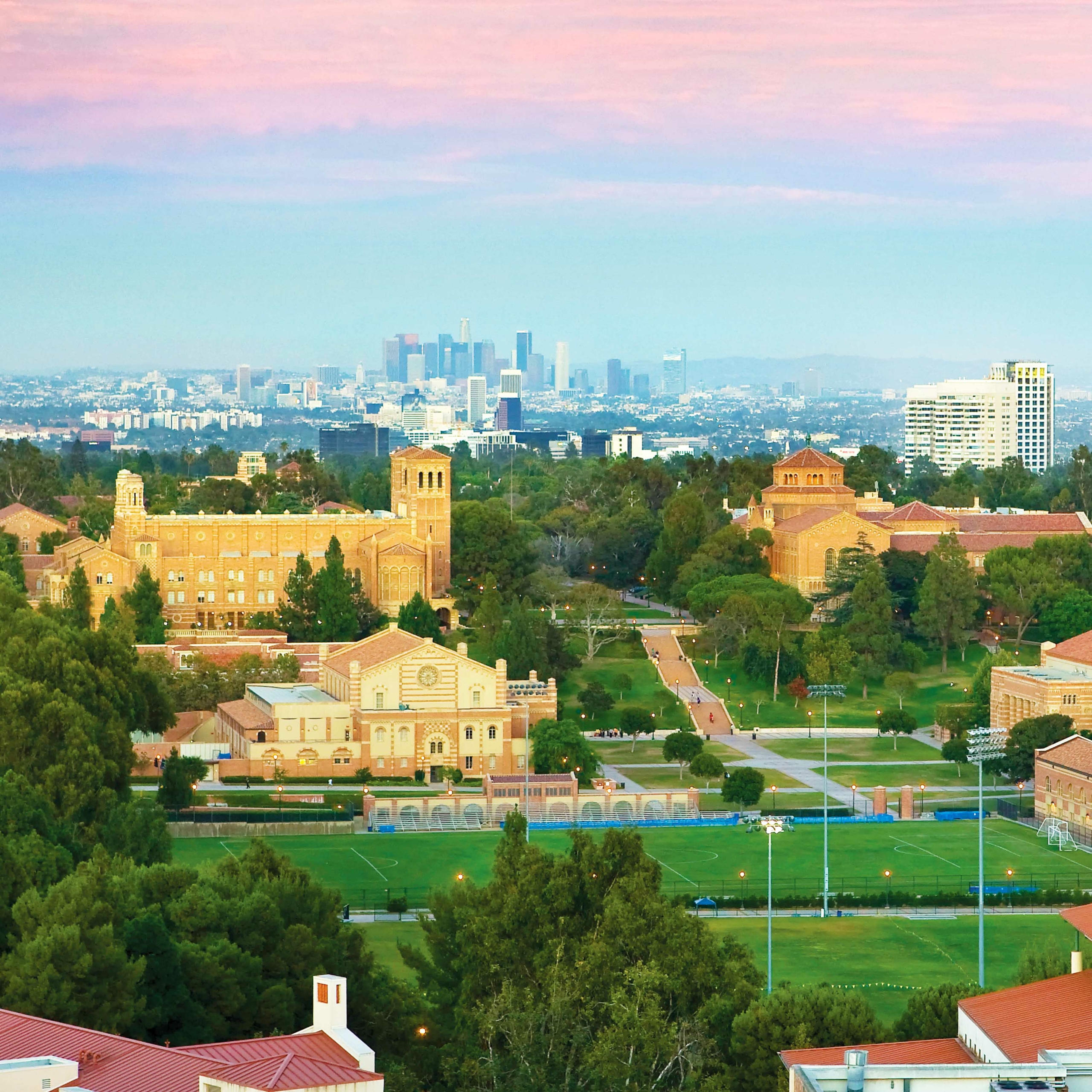 UCLA campus at twilight with Los Angeles skyline in the background