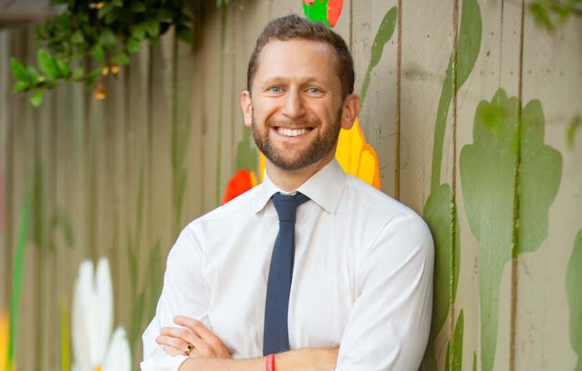 Bearded man in white shirt and tie