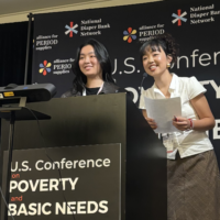 two young women at podium