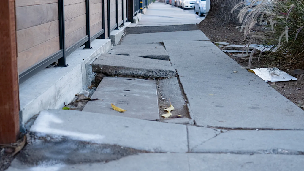 sidewalk with cracked concrete