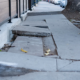 sidewalk with cracked concrete