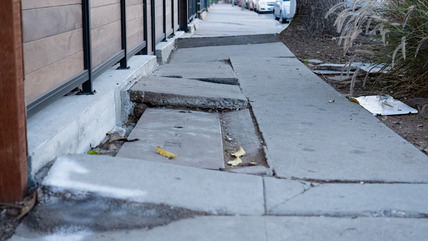 sidewalk with cracked concrete