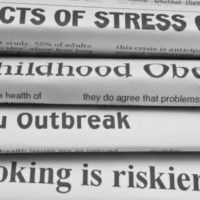 stack of newspapers with headlines on health issues