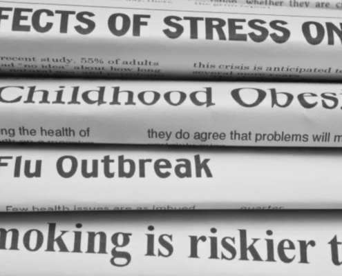 stack of newspapers with headlines on health issues