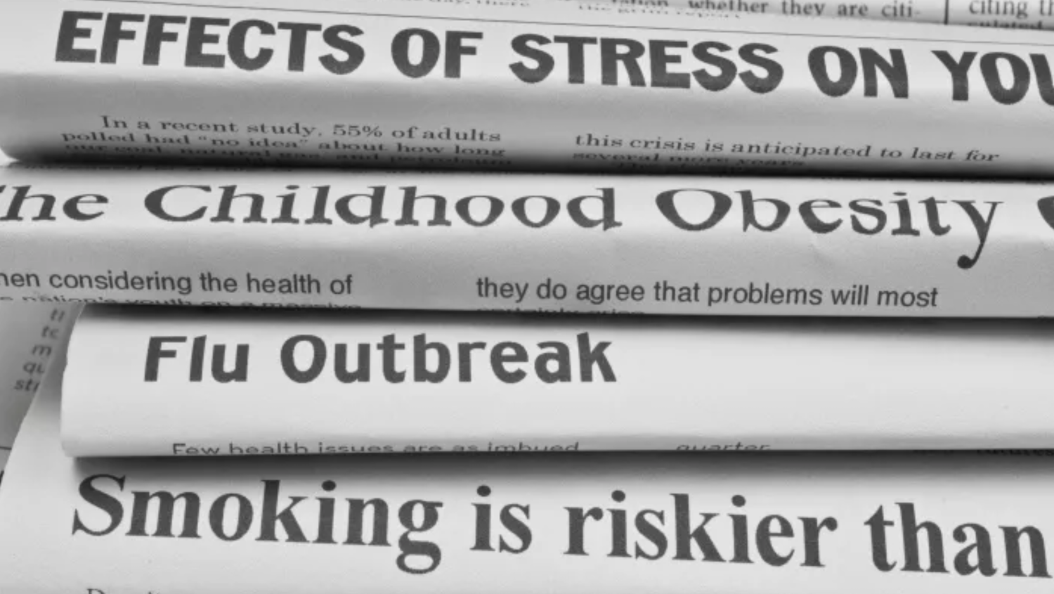 stack of newspapers with headlines on health issues