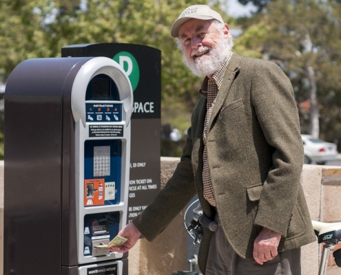 Man at parking kiosk
