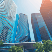 Shade combats urban heat A photo of tall skycrapers coming a semi circle on a bright sunny day with the shadow of some of the building being cast on a few.