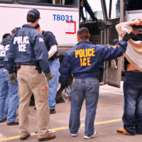 Photo of ICE agents making an arrest.