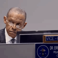 LA Police Commissioner_LAT Man in suit and glasses seated at meeting