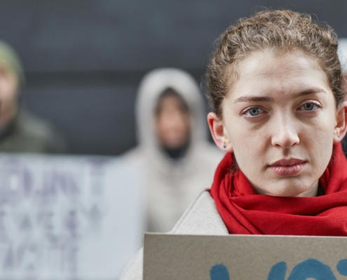 woman in red scarf at protest