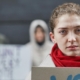woman in red scarf at protest