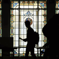 LAT Latino vote silhouette of voters against stained-glass background
