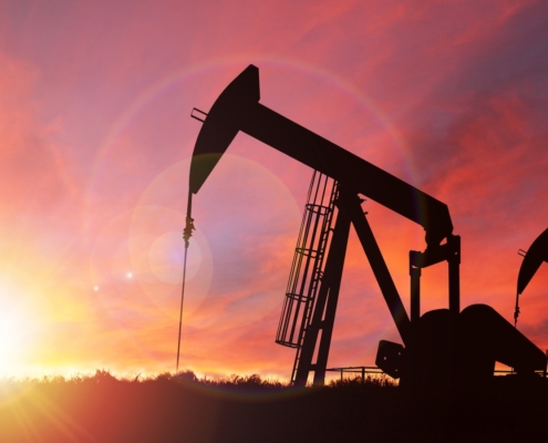 Oil well at sunset.