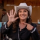 Selina Barajas is wearing a cowboy hat and pointing to her right hand with 5 fingers for Ward 5, the district in Tucson City Council she now represents.
