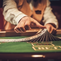 Croupier behind gambling table in a casino Croupier behind gambling table in a casino.