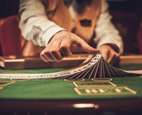 Croupier behind gambling table in a casino.