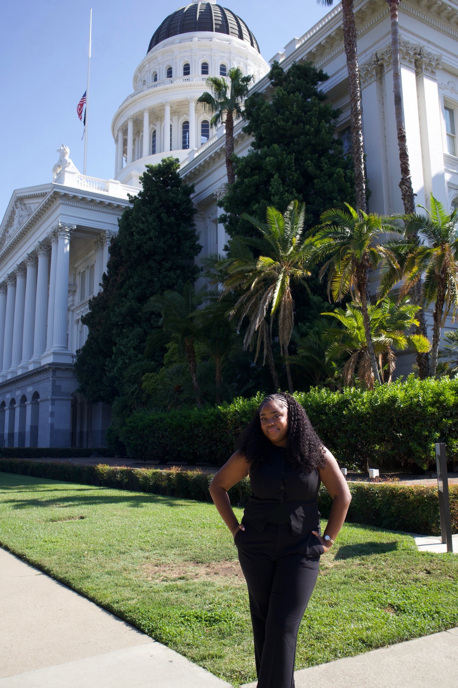 maleeyah frazier stands in front of sacramento capitol building