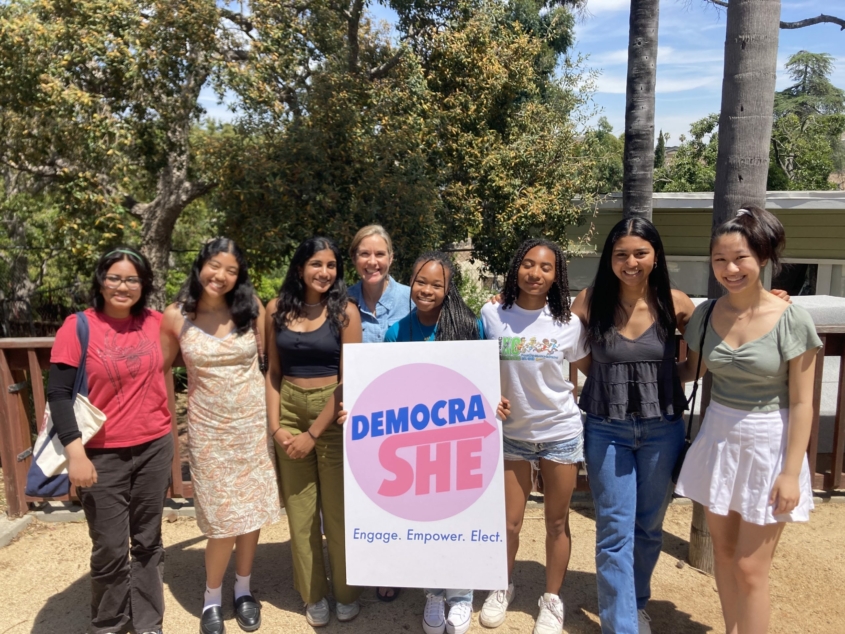 Group photo of Sarah Jakle at a DemocraShe event.