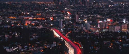 Aerial view of LA skyline and congested freeways at night