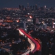 Aerial view of LA skyline and congested freeways at night