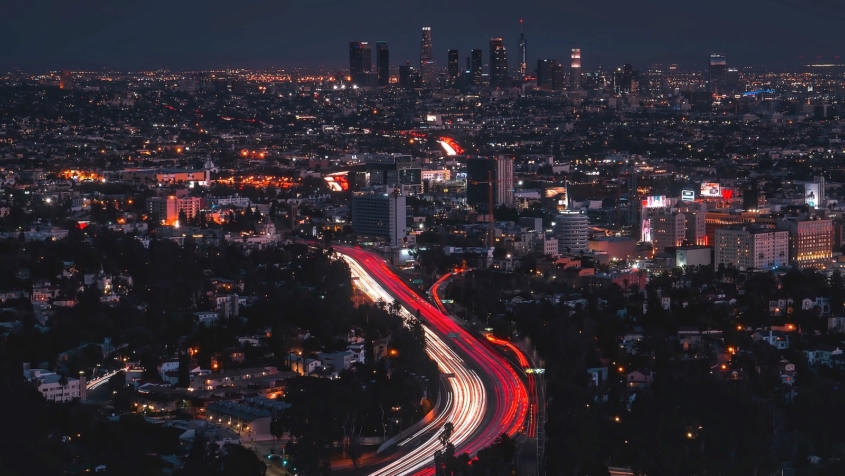 Aerial view of LA skyline and congested freeways at night