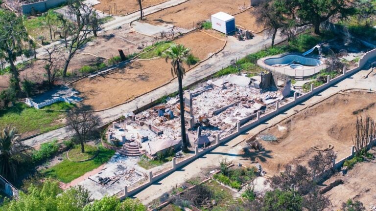 Ruins of a home after a wildfire.|
