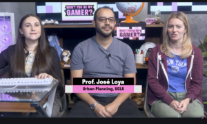 Assistant Professor José Loya sits between the two hosts of PBS SoCal’s Won’t You Be My Gamer? during the show’s gameplay and discussion.