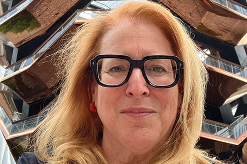 portrait of woman with glasses and light-colored hair
