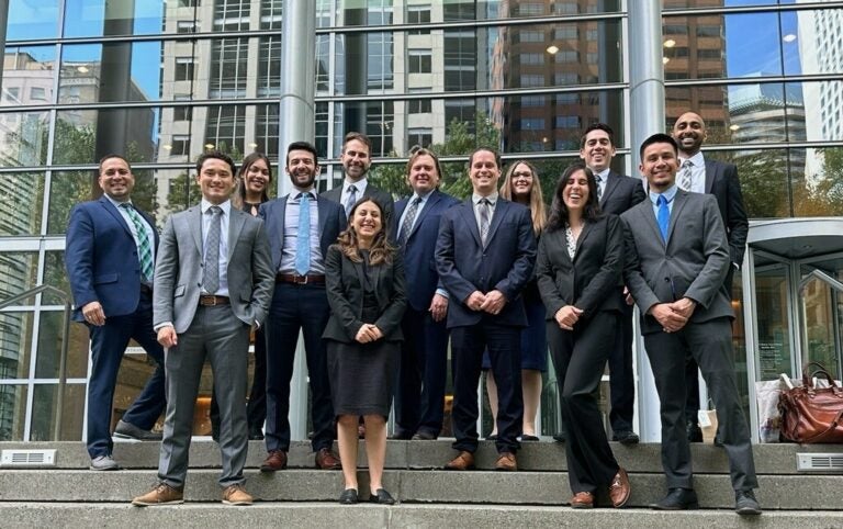Group photo of the Voting Rights Project team including students and Chad Dunn and Matt Barreto.|Voting Rights Project team stands in front of the States of United States Court House|Galveston Trial group photo of Voting Rights Project Team with Chad Dunn|headshot of Chad Dunn|