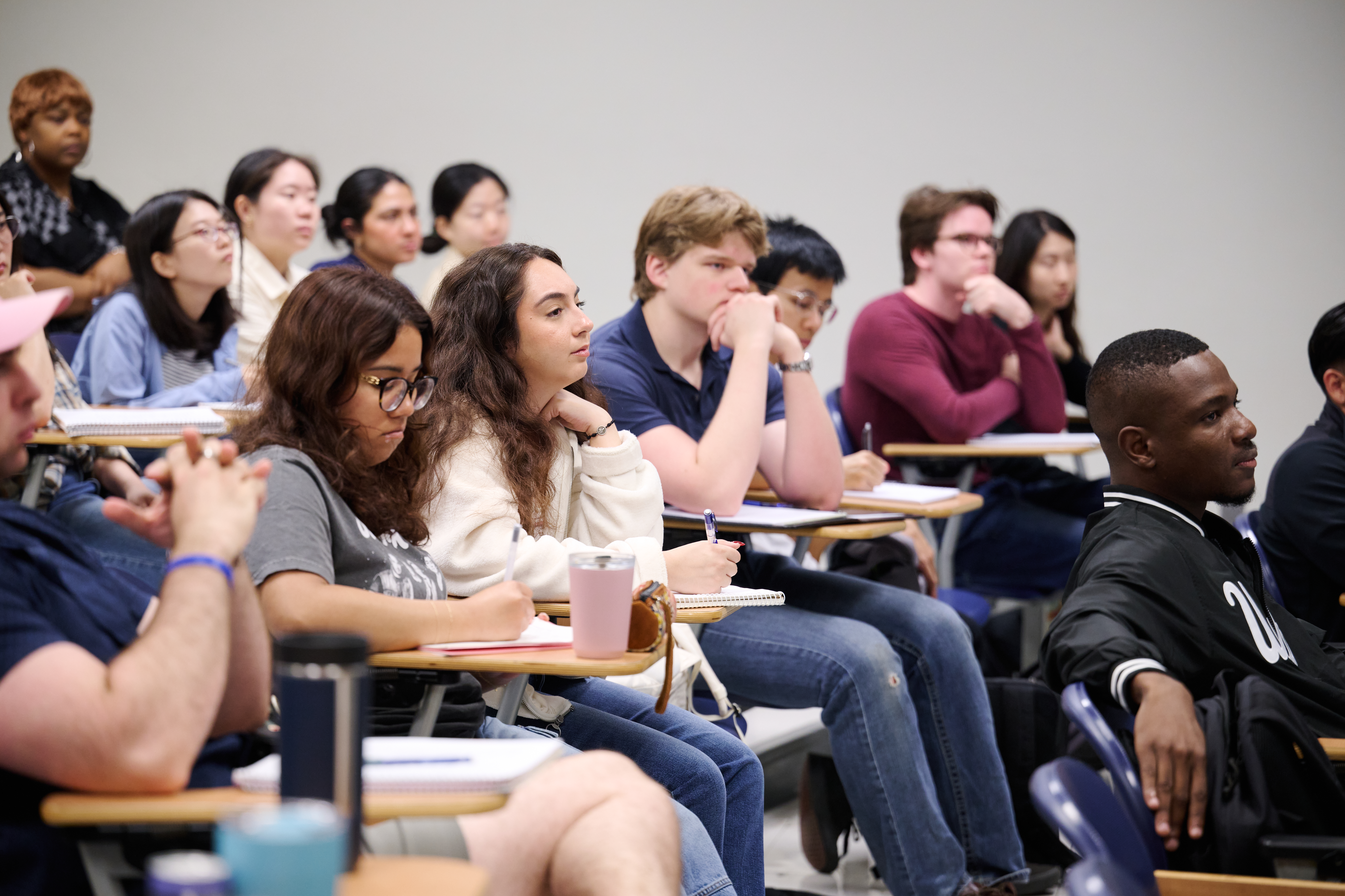 Public policy students in class listening to a lecture