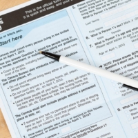 US, Census form document with pen on top