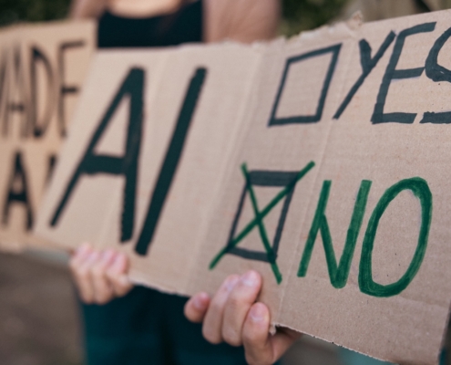 protest signs in opposition to artificial intelligence