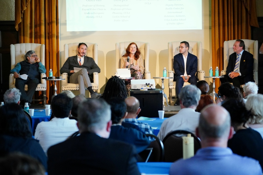 5 panelists sit on stage in the UCLA Kerckhoff Grand Salon for the 2026 Berggruen Governance Index "Four Worlds of Governance" event on May 6.