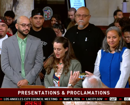 Los Angeles City Council Meeting on May 8, a speaker presents José Loya and Amada Armenta with their "impactful chicanos" award at City Hall.