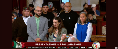 Los Angeles City Council Meeting on May 8, a speaker presents José Loya and Amada Armenta with their "impactful chicanos" award at City Hall.