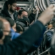 People taking the subway.